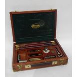 A Parker-Hale 12 gun cleaning kit with rods, brushes, snap caps,
