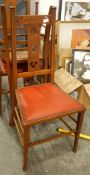 A set of four oak chairs with two matching carvers,