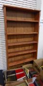 An oak open bookcase with five shelves,