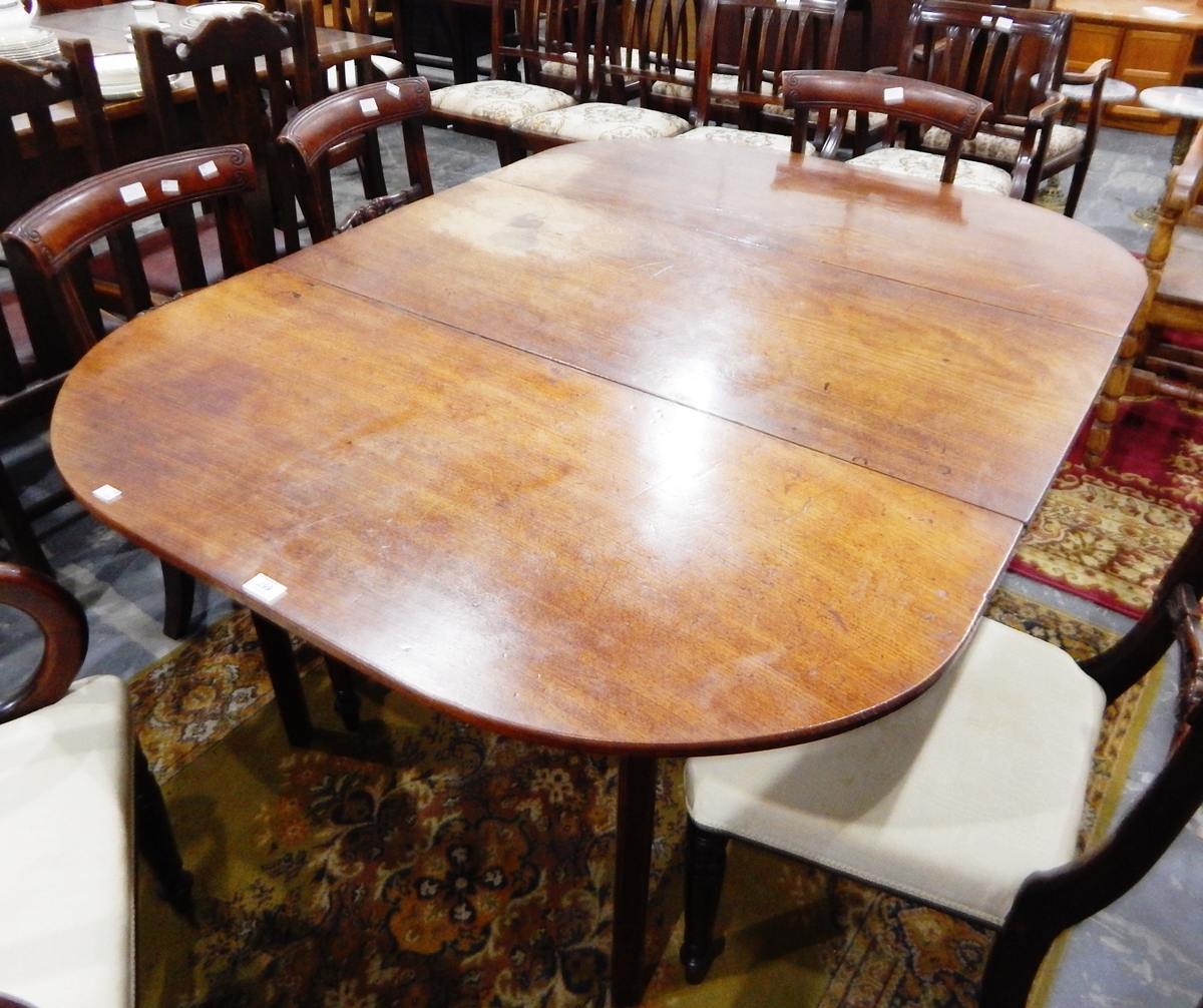 A 19th century mahogany drop-leaf dining table,