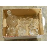 A cut glass decanter, various cut glass stoppers, another decanter, glass bell, etc.