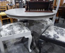 A circular grey painted pedestal kitchen table and four Queen Anne style dining chairs with vase