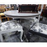 A circular grey painted pedestal kitchen table and four Queen Anne style dining chairs with vase