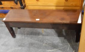 An oak stained low occasional table on square tapering legs,