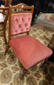 An Edwardian mahogany nursing chair, with button panelled back, upholstered seat,