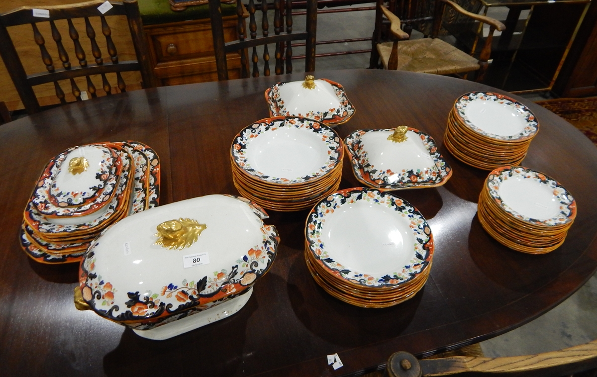 A Copeland Spode part dinner service decorated with a band of flowers in the Imari palette,