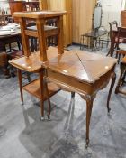 An early 20th century mahogany envelope card table with baize lined top and on cabriole shaped