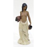 A Lladro figure of a woman carrying water pitchers,