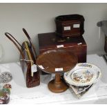 A turned oak mahogany stand with dished top on circular foot, a desk tidy,