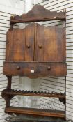 A stained wood hanging wall cupboard,