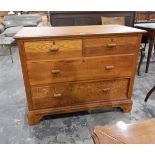 A 20th century oak chest of two short and two long drawers, on bracket feet,