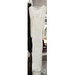 A cream devore velvet full length wedding dress by Liz Lippiat with long sleeves