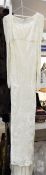 A cream devore velvet full length wedding dress by Liz Lippiat with long sleeves