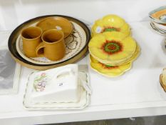 A suite of Royal Doulton china comprising five plates and one oblong dish modelled as yellow