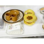 A suite of Royal Doulton china comprising five plates and one oblong dish modelled as yellow