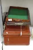 Two small leather suitcases and two rectangular trays