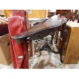 A shaped mahogany hall table having a single carved and cabriole shaped support with small