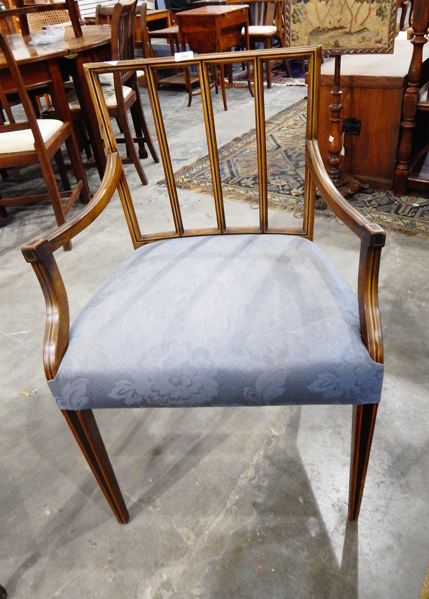 A Sheraton style open armchair with square splat back, upholstered stuffover seat,