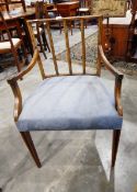 A Sheraton style open armchair with square splat back, upholstered stuffover seat,