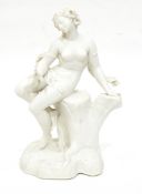 A mid-Victorian Worcester Parian figure of Psyche, seated on a tree stump,