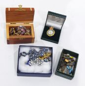 A quantity of costume jewellery and enamel badges