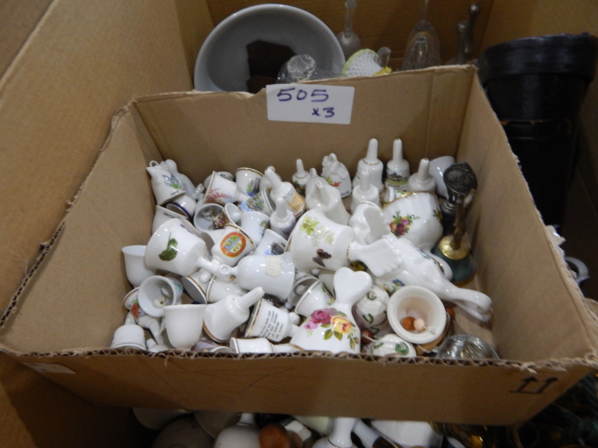 Assorted glassware and a large quantity of ceramic and other bells (2 boxes)
