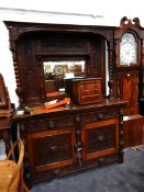 A Victorian carved oak mirror back sideboard, with foliate carved decoration,
