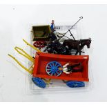 A Britains painted lead model of a cart, another cart model and associated carthorses, etc.