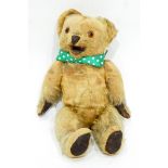A vintage mohair bear with open mouth mechanism, having button lever at the back,
