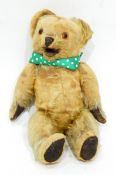 A vintage mohair bear with open mouth mechanism, having button lever at the back,