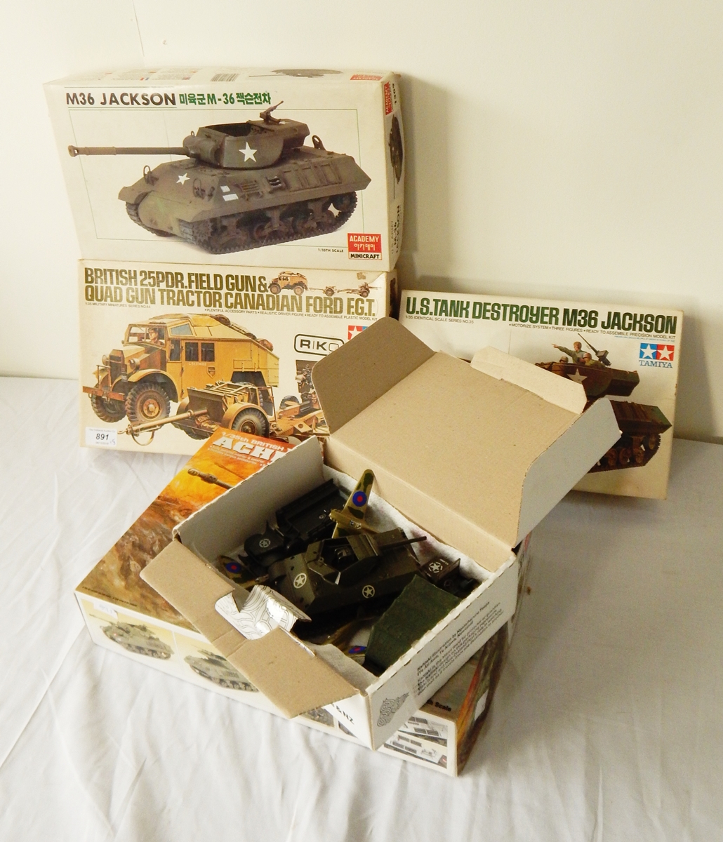 A Tamiy model kit of a British 25PDR field gun and quad gun tractor, another of a tank,