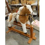 A Mulholland and Baillie plush bodied rocking horse on fine cruciform stretcher