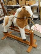 A Mulholland and Baillie plush bodied rocking horse on fine cruciform stretcher