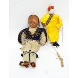 Early 20th century paper head and soft bodied doll in Turkish style dress and an Oriental puppet