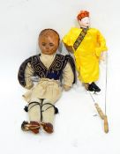 Early 20th century paper head and soft bodied doll in Turkish style dress and an Oriental puppet