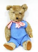 A 1930's/40's plush bear with plastic eyes,