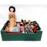 A quantity of souvenir dolls including one dressed as a Geisha, one in Dutch costume, etc.