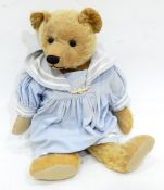 A vintage mohair bear with button eyes