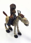 A Luntoy lead model 'Hank and Trigger' and a tinplate model pram with folding hood