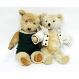 A plush teddy bear with plastic eyes and another dressed in a knitted green romper suit (2)