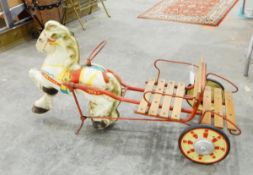 A child's tricycle, the front with prancing tinplate horse and with wooden seat,