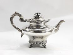 Victorian silver teapot, oblate, the hinged lid with flowerhead finial,