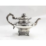 Victorian silver teapot, oblate, the hinged lid with flowerhead finial,