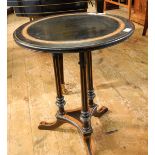 Ebonised circular occasional table with strung burr walnut border, on fluted columns,