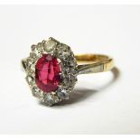 Pink stone and diamond cluster ring set oval facet-cut pink stone,