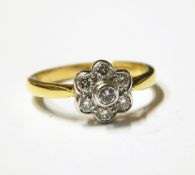 18ct gold and diamond flowerhead cluster ring set with six brilliant cut diamonds surrounding a