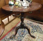 Late 17th/early 18th century mahogany circular tilt-top table raised on turned pedestal and tripod