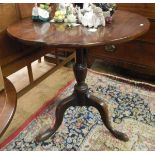 Late 17th/early 18th century mahogany circular tilt-top table raised on turned pedestal and tripod