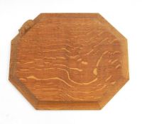 Robert Thompson of Kilburn Mouseman oak bread board of octagonal form with carved mouse signature,