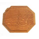 Robert Thompson of Kilburn Mouseman oak bread board of octagonal form with carved mouse signature,